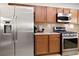 Kitchen with stainless steel refrigerator, gas range and ample cabinetry at 174 Augusta Course Ave, Las Vegas, NV 89148