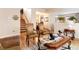 Open-concept living area with a staircase and dining area, creating a bright and airy space at 174 Augusta Course Ave, Las Vegas, NV 89148