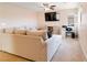 Bright living room with a comfy sectional couch, ceiling fan, and built-in media center at 174 Augusta Course Ave, Las Vegas, NV 89148