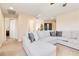 Upstairs living area with a large sectional sofa, neutral carpet and plenty of natural light at 174 Augusta Course Ave, Las Vegas, NV 89148
