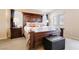 Spacious bedroom featuring a large decorative headboard, plush bedding, and neutral decor, perfect for relaxation at 174 Augusta Course Ave, Las Vegas, NV 89148