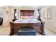 Well-lit main bedroom showcasing a decorative wooden bed frame, offering a comfortable and inviting space at 174 Augusta Course Ave, Las Vegas, NV 89148