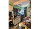 Cluttered kitchen with dated cabinets and appliances at 1955 Raindance Way, Las Vegas, NV 89169