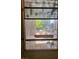 Close-up of window showing its condition and view to the home's exterior at 1955 Raindance Way, Las Vegas, NV 89169