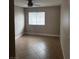 Bright bedroom featuring tile floors, a window, and neutral-colored walls at 2025 Cary Grant Ct, Las Vegas, NV 89142