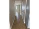 Well-lit hallway with neutral walls and tile floors, leading to various rooms at 2025 Cary Grant Ct, Las Vegas, NV 89142