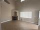 Spacious living room with fireplace, large window, and tile flooring at 2025 Cary Grant Ct, Las Vegas, NV 89142