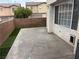 Concrete patio with artificial turf, surrounded by brick wall, exterior at 2025 Cary Grant Ct, Las Vegas, NV 89142