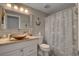 Nautical themed bathroom features a decorative sink and vanity, a seashell shower curtain, and ocean-inspired decor at 209 Tamarack Dr, Henderson, NV 89002