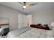 Spacious bedroom with a comfortable bed, ceiling fan, and ample natural light at 209 Tamarack Dr, Henderson, NV 89002