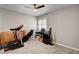 Bedroom with a ceiling fan, a window with a white shutter, a desk, a treadmill and other boxes at 209 Tamarack Dr, Henderson, NV 89002