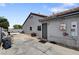 Side yard of home, utility access, and pool in the background at 209 Tamarack Dr, Henderson, NV 89002