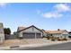 Inviting single-story home with a two-car garage, tiled roof, desert landscaping, and ample parking at 209 Tamarack Dr, Henderson, NV 89002