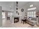 Bright and airy living room with a fireplace, comfortable seating, and seamless flow to the dining area at 209 Tamarack Dr, Henderson, NV 89002