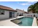 Beautiful swimming pool with mature palm tree; a tranquil oasis for outdoor enjoyment at 209 Tamarack Dr, Henderson, NV 89002