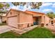 Single-story home with a two-car garage, desert landscaping, and a cozy front porch at 2104 Kendall Hill Ave, Las Vegas, NV 89106
