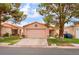 Charming single-story home with a two-car garage, desert landscaping, and a cozy front porch at 2104 Kendall Hill Ave, Las Vegas, NV 89106