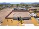 Aerial view of a home with desert landscaping, an expansive lot, and a spacious driveway at 211 E Kimberly Dr, Henderson, NV 89015