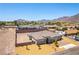 Aerial shot of a home with desert landscaping, expansive backyard, and stunning mountain views at 211 E Kimberly Dr, Henderson, NV 89015