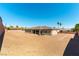 Expansive backyard offering a blank canvas for creating an outdoor oasis with desert surroundings at 211 E Kimberly Dr, Henderson, NV 89015