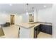 Stylish bar area with modern countertops, cabinetry, and a sleek design, perfect for entertaining guests at 211 E Kimberly Dr, Henderson, NV 89015