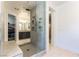 Walk-in shower with a seating area, tiled surround and double shower heads at 211 E Kimberly Dr, Henderson, NV 89015