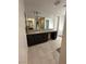 Spacious bathroom featuring a double vanity and modern tile flooring at 211 E Kimberly Dr, Henderson, NV 89015