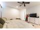 Bright bedroom featuring a ceiling fan, and a dresser with a television at 211 E Kimberly Dr, Henderson, NV 89015