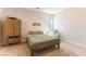 Cozy bedroom featuring neutral decor, a comfortable bed, and woven storage baskets for a relaxing atmosphere at 211 E Kimberly Dr, Henderson, NV 89015