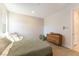 Bright bedroom featuring modern decor, a comfortable bed, and wooden drawers for a relaxing atmosphere at 211 E Kimberly Dr, Henderson, NV 89015