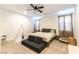 Bright bedroom featuring a ceiling fan, carpet flooring, and a cozy play area at 211 E Kimberly Dr, Henderson, NV 89015