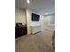 Bedroom features neutral carpet, TV, and lots of open space at 211 E Kimberly Dr, Henderson, NV 89015