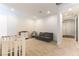 Bonus room area featuring carpet flooring, a crib, and comfortable seating at 211 E Kimberly Dr, Henderson, NV 89015