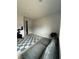 Bonus room with grey sofa, a patterned rug, and exercise equipment at 211 E Kimberly Dr, Henderson, NV 89015