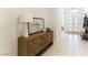 Inviting entryway features a stylish wood console table, bright lighting, and a welcoming ambiance at 211 E Kimberly Dr, Henderson, NV 89015