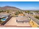 Spacious home featuring desert landscaping, block perimeter, RV parking, and a mountain view at 211 E Kimberly Dr, Henderson, NV 89015