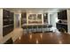 Spacious kitchen with dark cabinetry, stainless appliances, and an island with barstool seating for casual dining at 211 E Kimberly Dr, Henderson, NV 89015