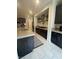 Contemporary kitchen with stainless appliances, dark cabinetry, light countertops, and an open layout at 211 E Kimberly Dr, Henderson, NV 89015