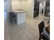 Modern kitchen featuring a breakfast bar with seating and stainless steel appliances at 211 E Kimberly Dr, Henderson, NV 89015