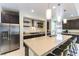 Bright kitchen with a spacious island, stainless steel appliances, and dark wood cabinets for a modern look at 211 E Kimberly Dr, Henderson, NV 89015