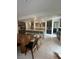 Well-lit kitchen featuring stainless steel appliances, spacious countertops, an island and dark cabinetry at 211 E Kimberly Dr, Henderson, NV 89015