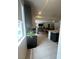 Open floor plan with kitchen island, seamlessly connects to the living area, creating an inviting space at 211 E Kimberly Dr, Henderson, NV 89015