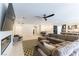 Spacious living area boasts modern fireplace, sleek ceiling fan, and tile flooring with an open concept layout at 211 E Kimberly Dr, Henderson, NV 89015