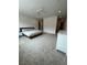 Spacious main bedroom features neutral carpet, ceiling fan, and lots of open space at 211 E Kimberly Dr, Henderson, NV 89015