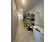 Organized walk-in pantry with extensive shelving and storage, ideal for maintaining a tidy and efficient kitchen at 211 E Kimberly Dr, Henderson, NV 89015