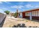 Home exterior with long covered porch, desert landscaping, a fenced yard and a pool at 2116 Cameron St, Las Vegas, NV 89102