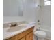 Cozy bathroom featuring a bathtub with shower and wooden vanity at 2116 Cameron St, Las Vegas, NV 89102