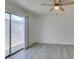 Bright bedroom with wood-look floors and a sliding glass door leading to the backyard at 2116 Cameron St, Las Vegas, NV 89102