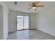 Bedroom featuring wood-look floors, a ceiling fan, and a sliding glass door to the yard at 2116 Cameron St, Las Vegas, NV 89102