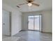 Bedroom with wood-look floors, ceiling fan, and sliding glass door to the backyard at 2116 Cameron St, Las Vegas, NV 89102